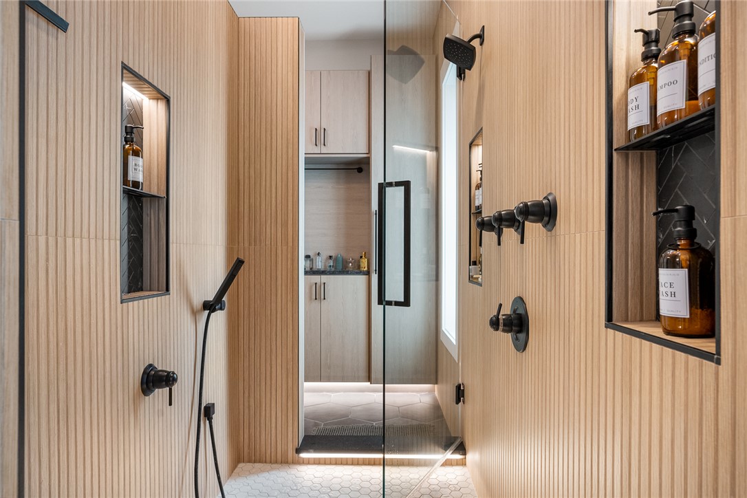 101 Casselberry Court Anderson, SC 29621 - Photo 25 of 48 This modern bathroom features a spacious shower with stylish tile work and practical built-in shelving.