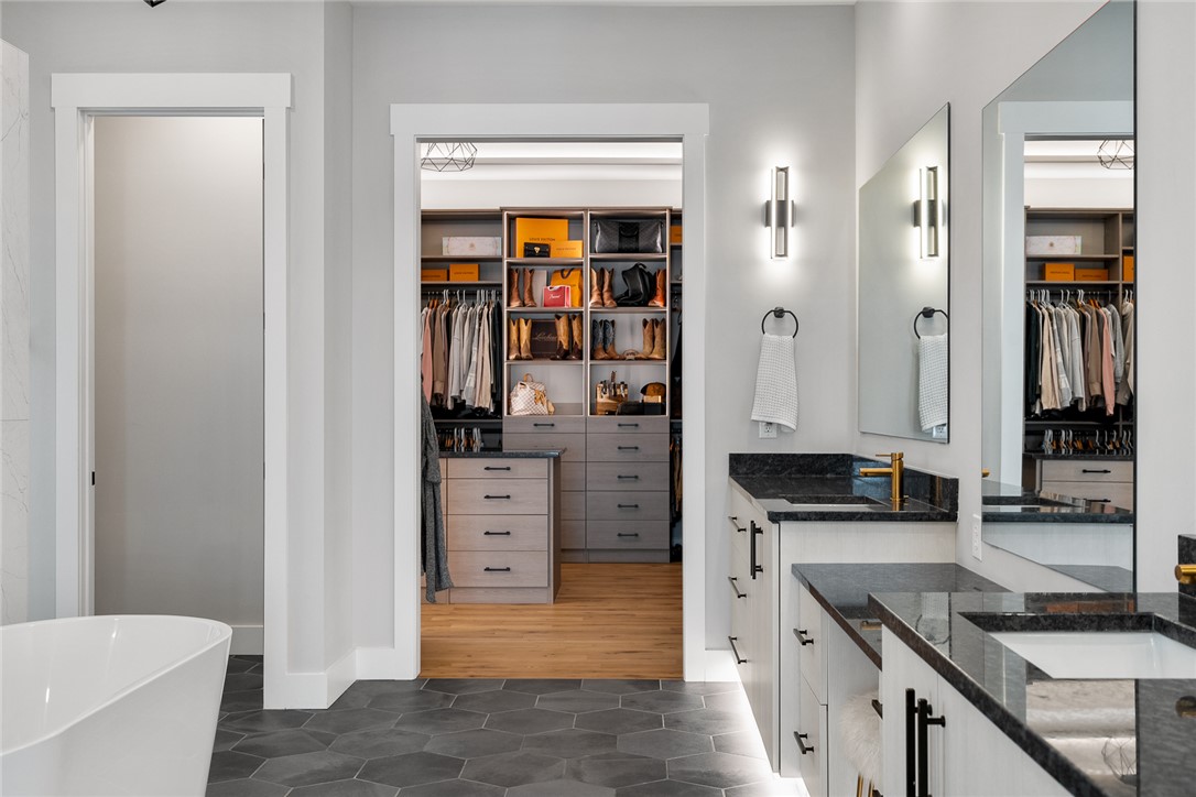 101 Casselberry Court Anderson, SC 29621 - Photo 26 of 48 This primary bathroom features a freestanding tub, dual vanities, and a custom walk-in closet.