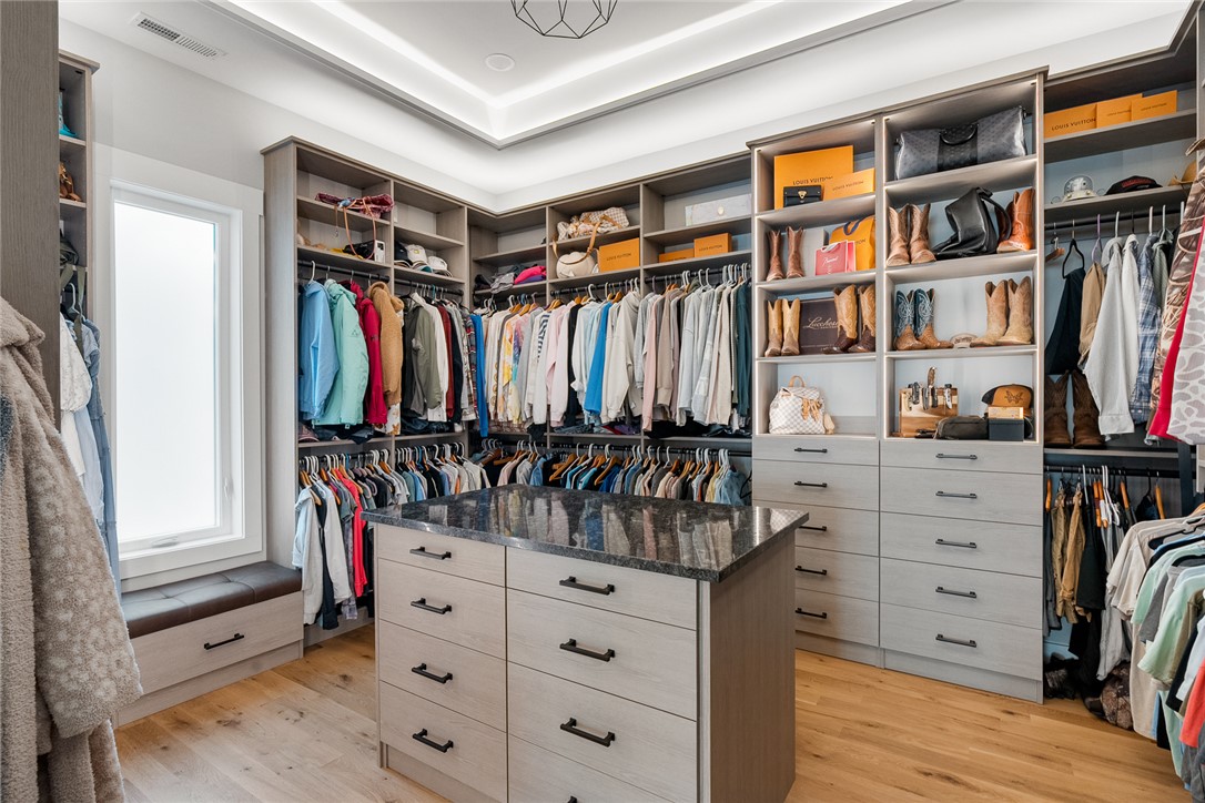 101 Casselberry Court Anderson, SC 29621 - Photo 27 of 48 This custom closet features abundant storage solutions and a central island with granite countertop.