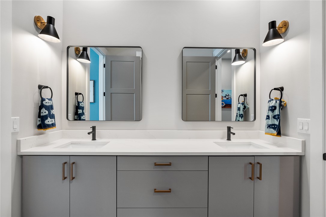 101 Casselberry Court Anderson, SC 29621 - Photo 31 of 48 This modern bathroom features a dual vanity with sleek countertops and stylish fixtures.