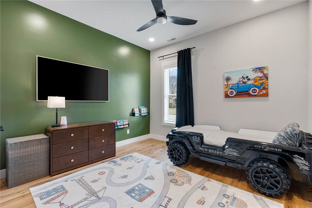101 Casselberry Court Anderson, SC 29621 - Photo 32 of 48 This spacious bedroom features warm wood flooring and a modern ceiling fan, creating a comfortable ambiance.