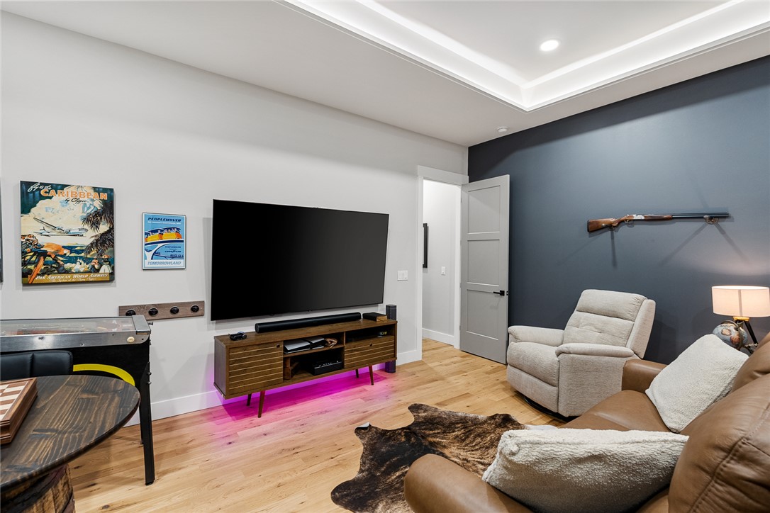 101 Casselberry Court Anderson, SC 29621 - Photo 34 of 48 This living area features rich wood flooring, high ceilings, and recessed lighting.