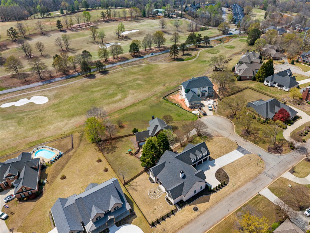 101 Casselberry Court Anderson, SC 29621 - Photo 46 of 48 An aerial view showcases a residential community with verdant golf course access and private pools.