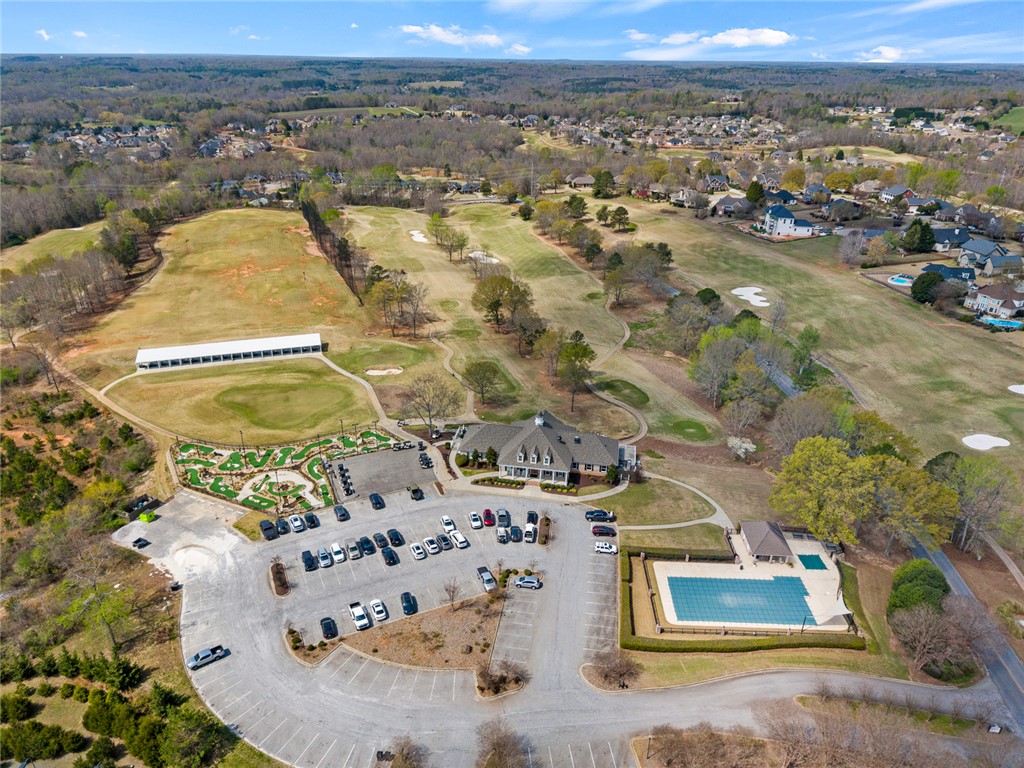 101 Casselberry Court Anderson, SC 29621 - Photo 47 of 48 An aerial view showcases a golf course with a clubhouse, pool, and ample parking.