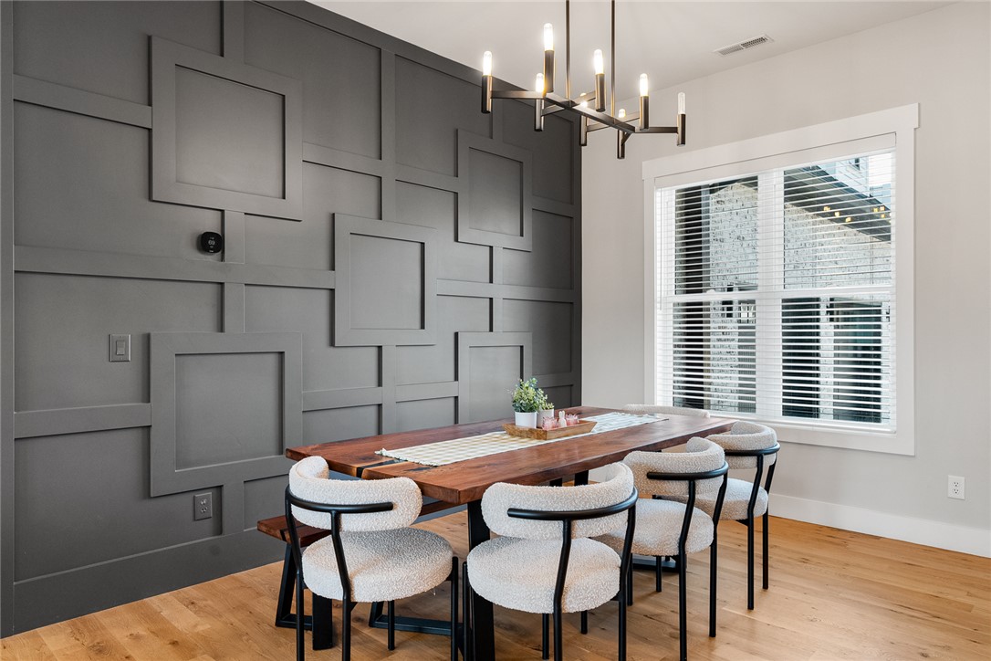 101 Casselberry Court Anderson, SC 29621 - Photo 7 of 48 This bright dining area features distinctive wall detailing and rich wood flooring.