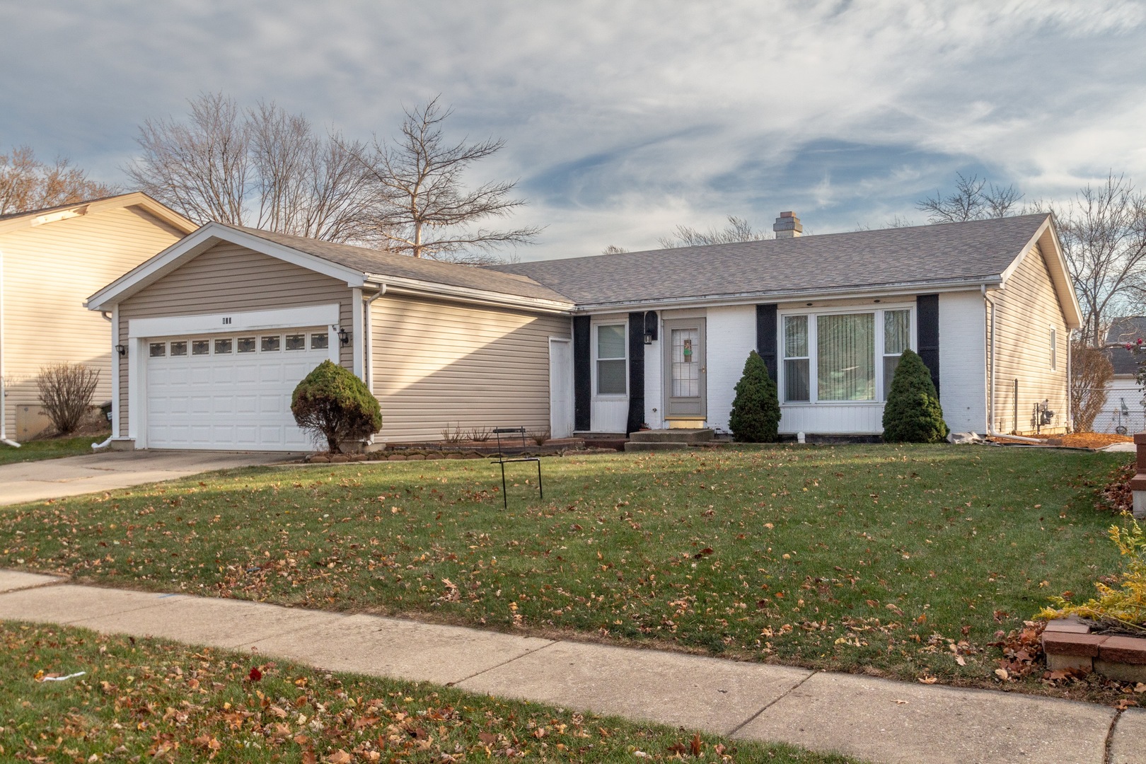 625 West Briarcliff Road Bolingbrook, IL 60440 - Photo 1 of 15 a front view of a house with a garden