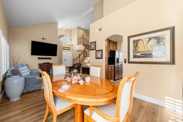 a bathroom with a tub a sink and a large window