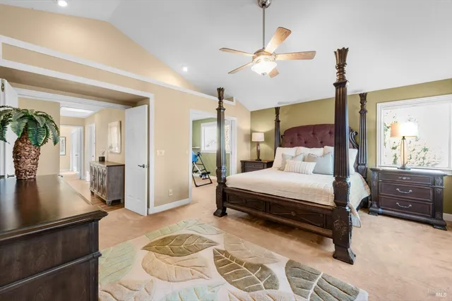 a view of walk in closet with clothes