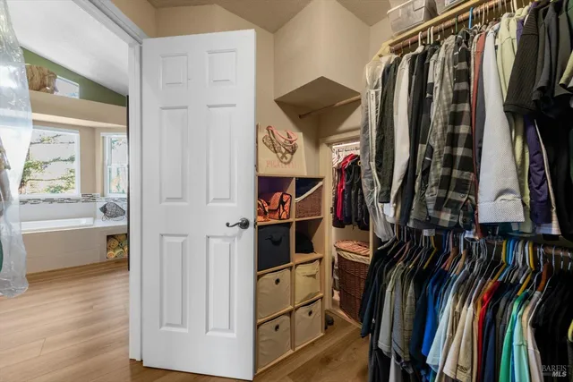 a view of a house with backyard sitting area and garden