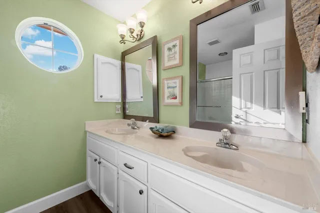 a front view of a house with a yard and mountain view