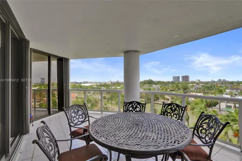 a view of a city from a dining room with furniture