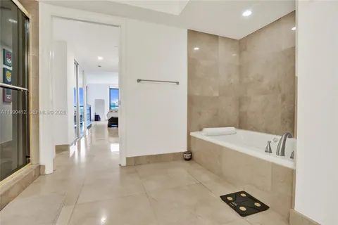 a bathroom with a tub and a sink