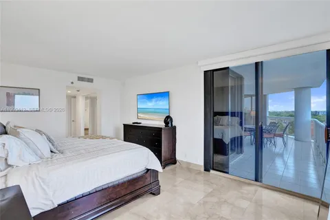 a bedroom with a bed and a table