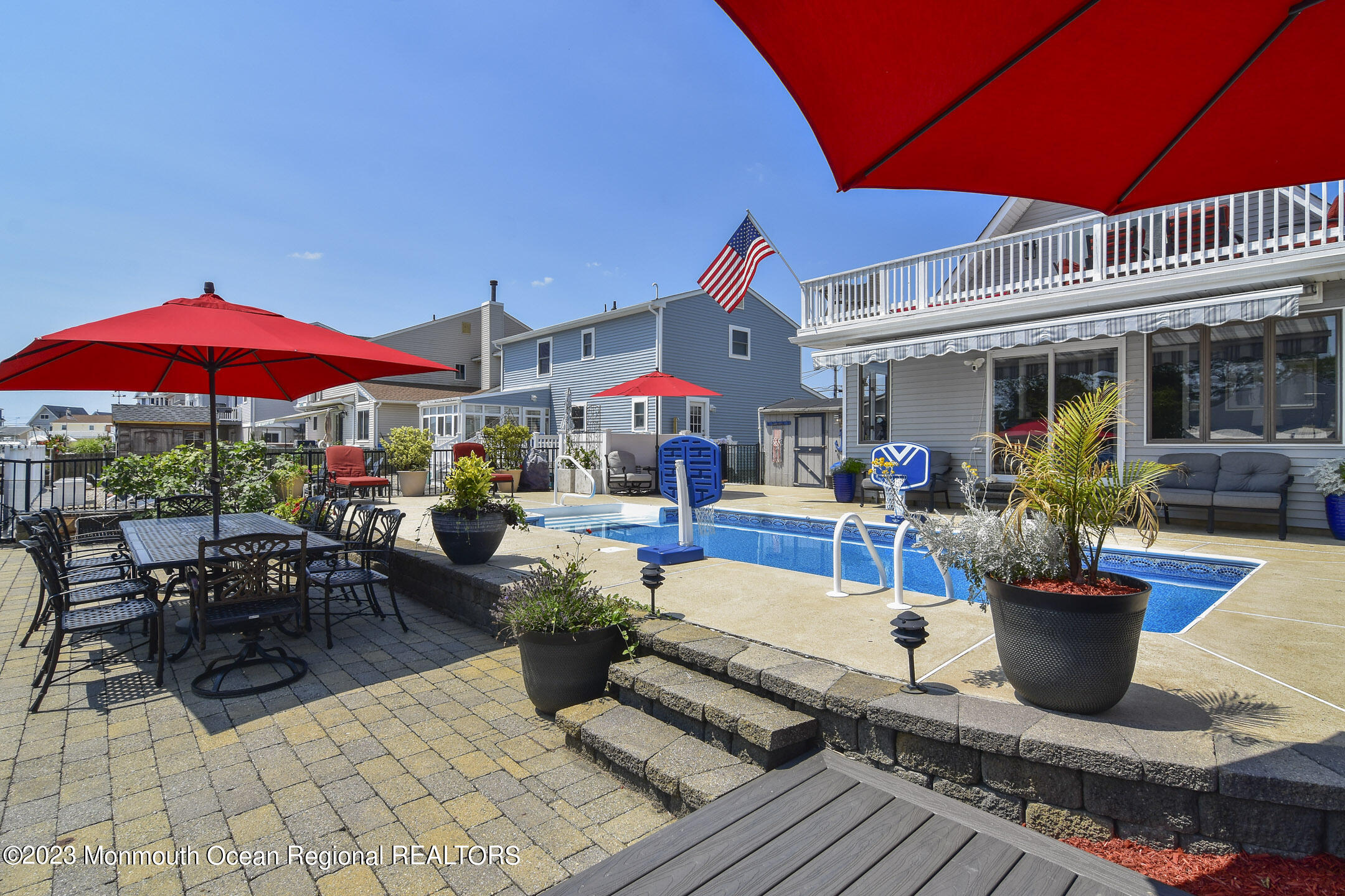 8 Rochester Drive Brick, NJ 08723 - Photo 16 of 41 a group of people sitting outside of a building