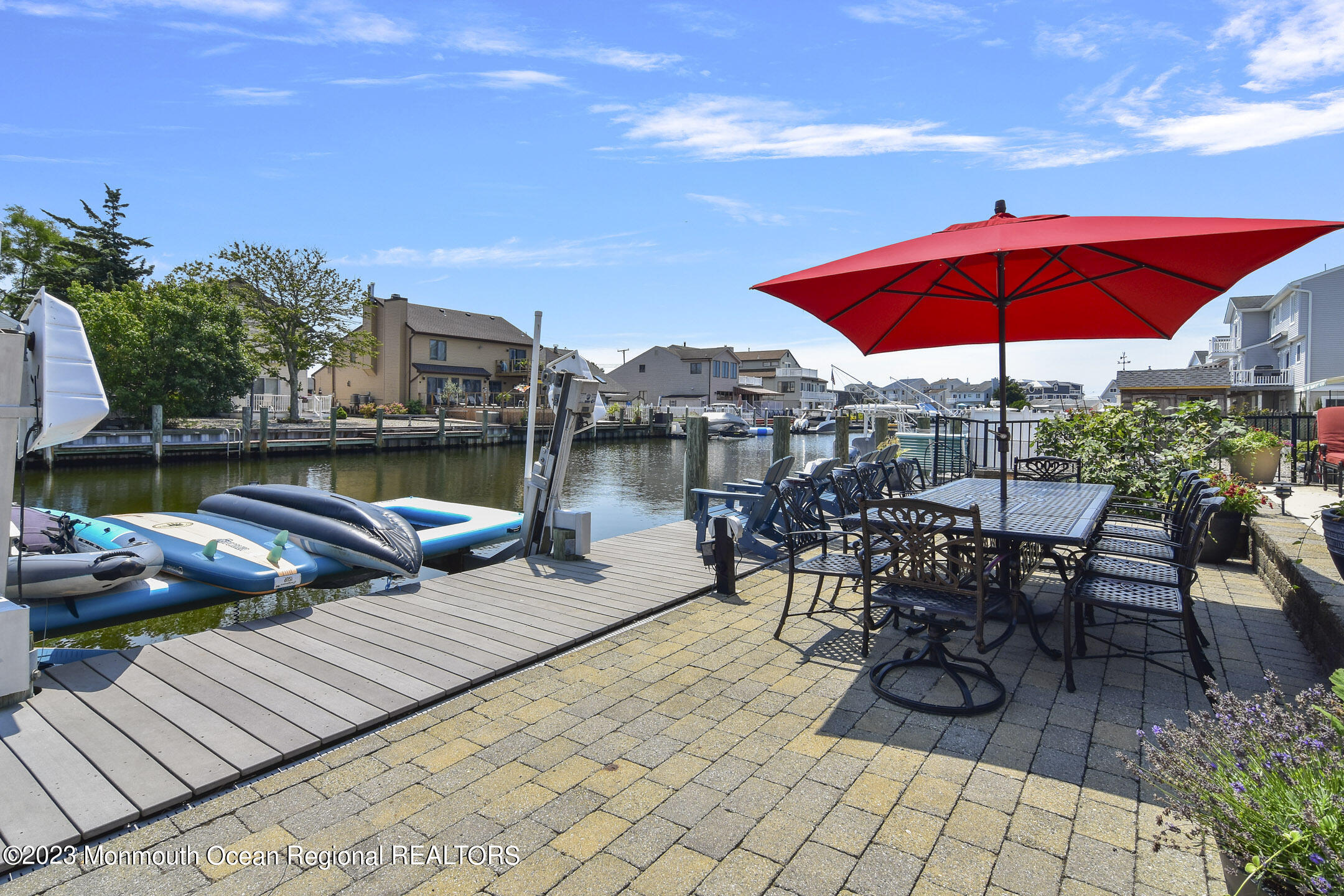 8 Rochester Drive Brick, NJ 08723 - Photo 17 of 41 an outdoor space with furniture and umbrella