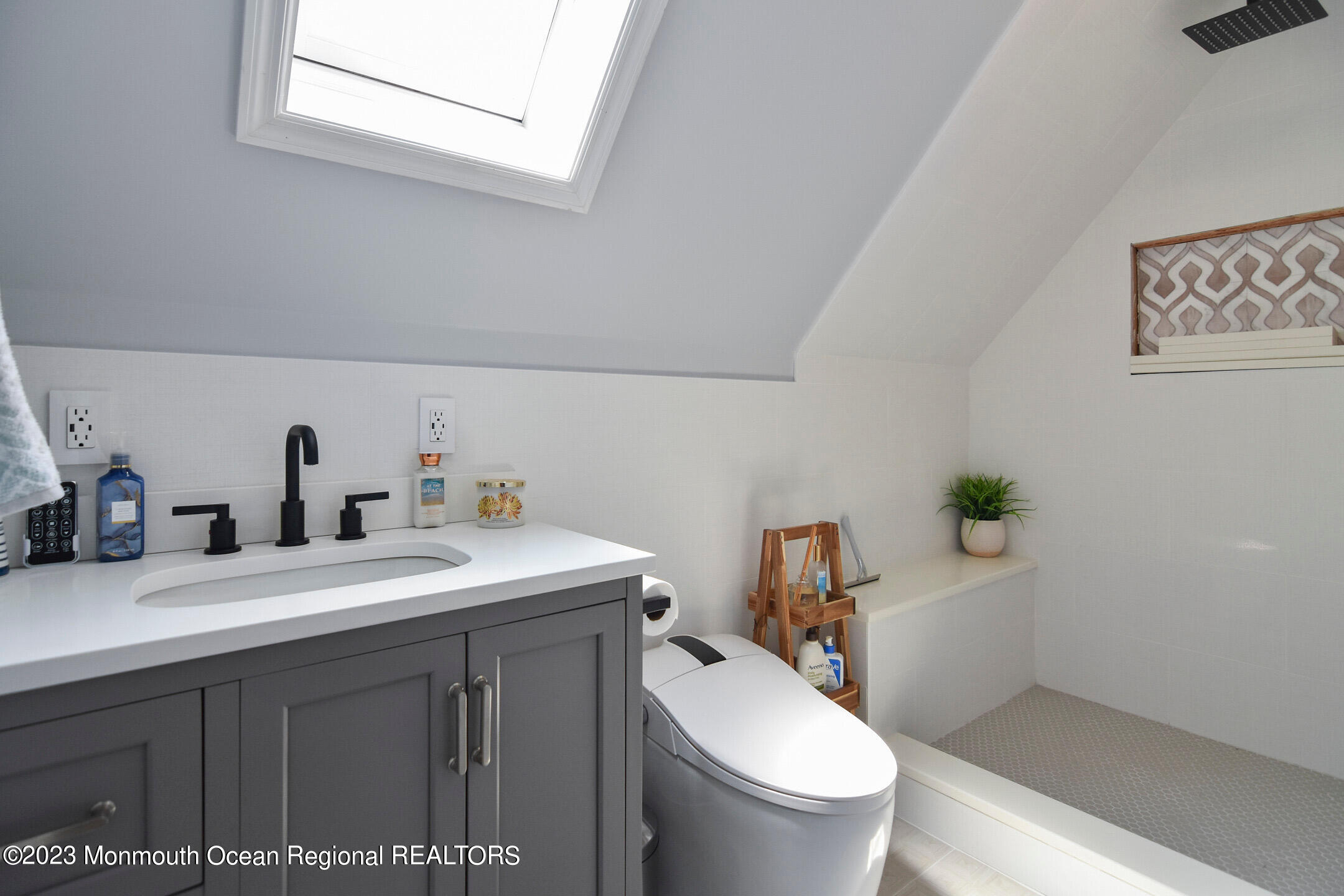 8 Rochester Drive Brick, NJ 08723 - Photo 27 of 41 a bathroom with a sink toilet and a mirror