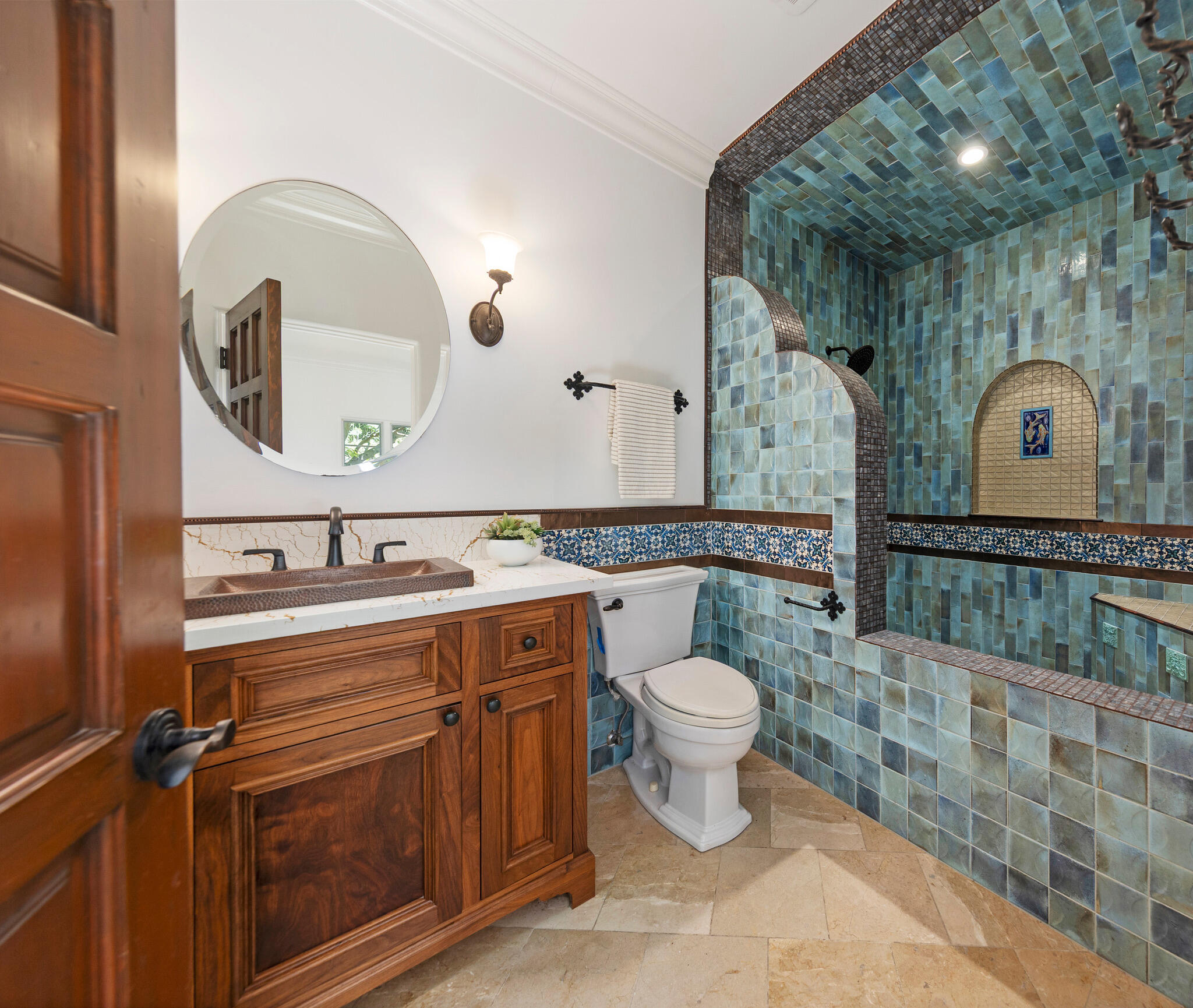 1493 Sycamore Canyon Road Montecito, CA 93108 - Photo 28 of 47 a bathroom with a toilet sink and mirror