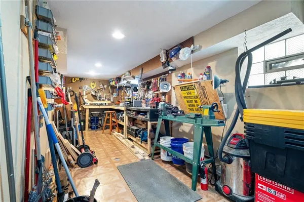 a view of walk in closet with clothes