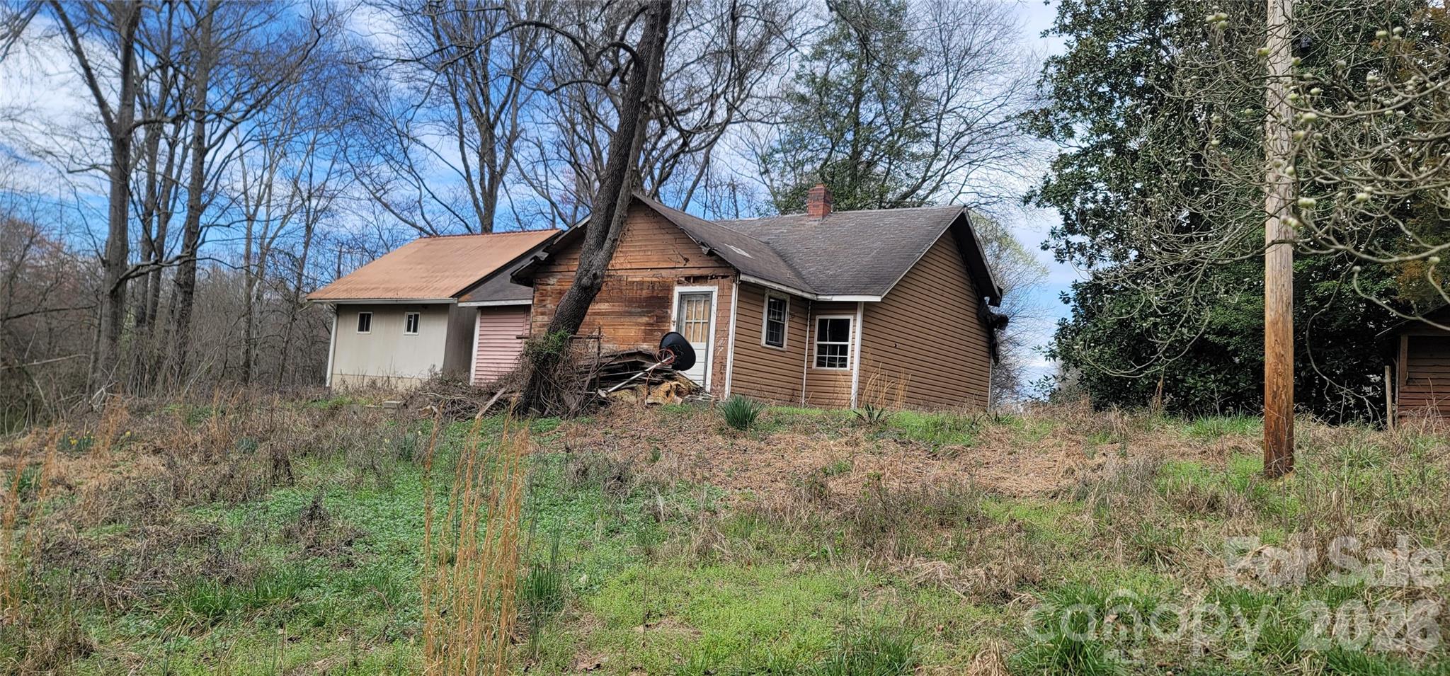 a house with trees in the background