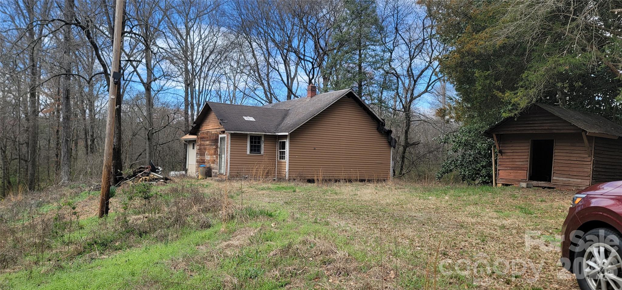 1939 River Road Lincolnton, NC 28092 - Photo 2 of 23 a view of a house with large trees