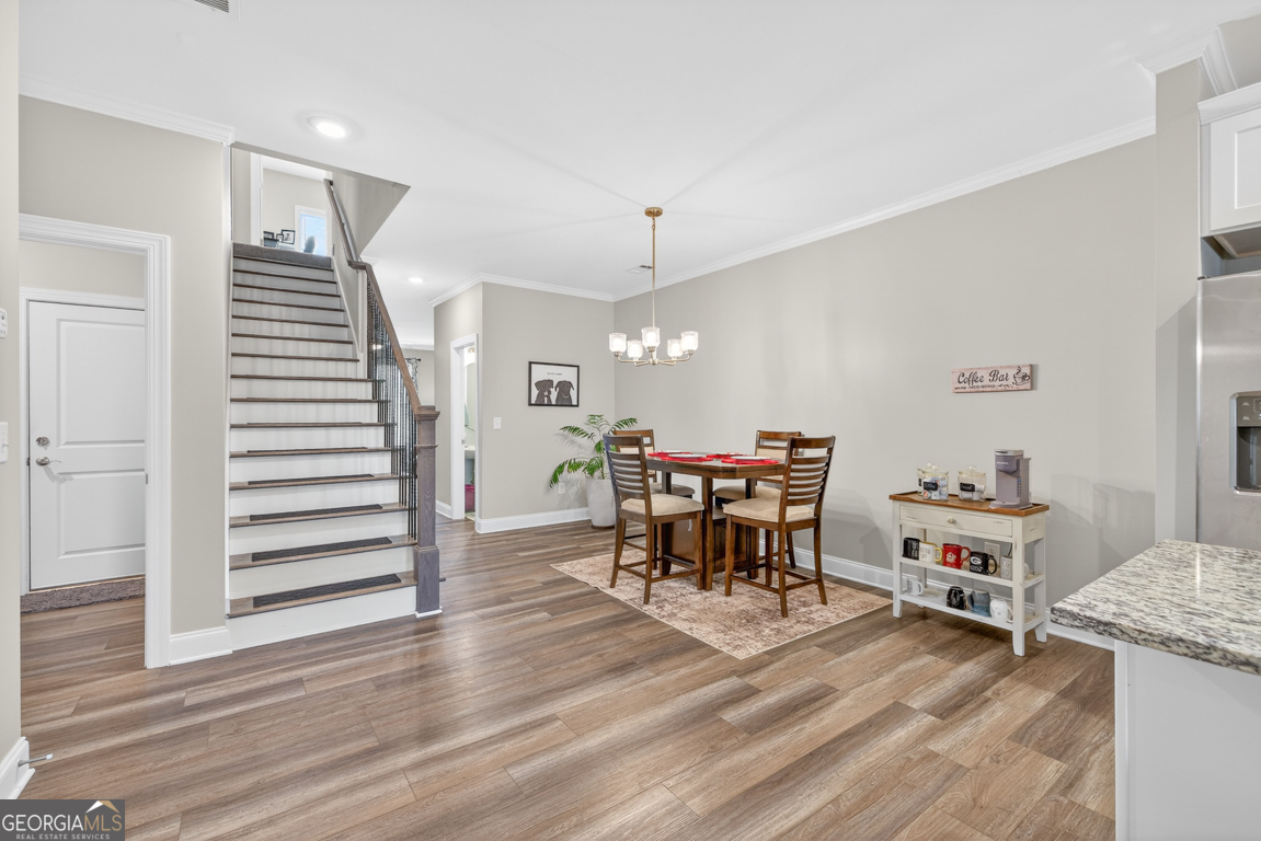 110 Magnolia Place Homer, GA 30547 - Photo 13 of 42 a view of a dining room with furniture and wooden floor