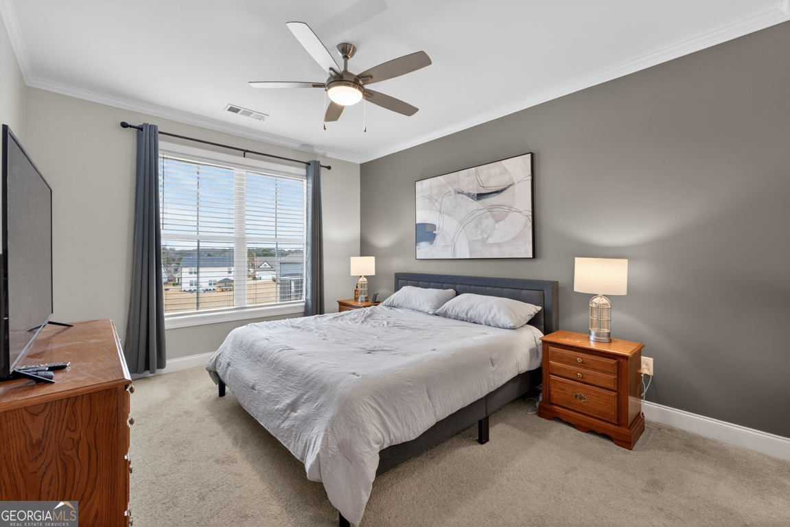 110 Magnolia Place Homer, GA 30547 - Photo 14 of 42 a bedroom with a bed and a large window