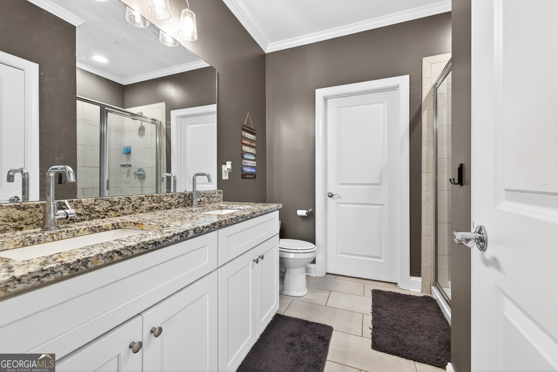 110 Magnolia Place Homer, GA 30547 - Photo 18 of 42 a bathroom with a granite countertop sink and a mirror