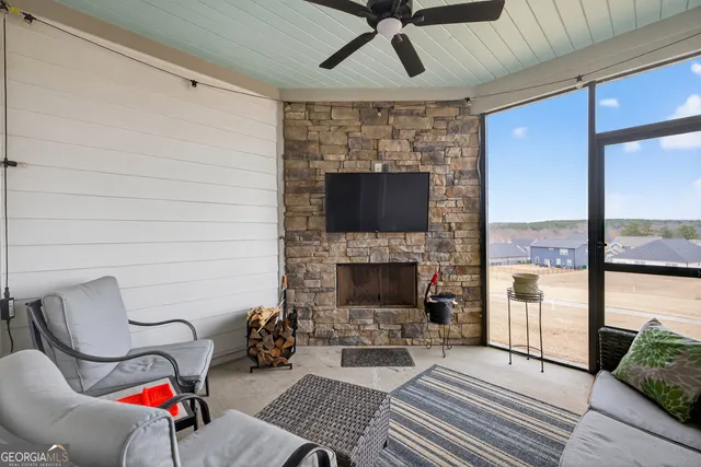 a living room with furniture and a fireplace