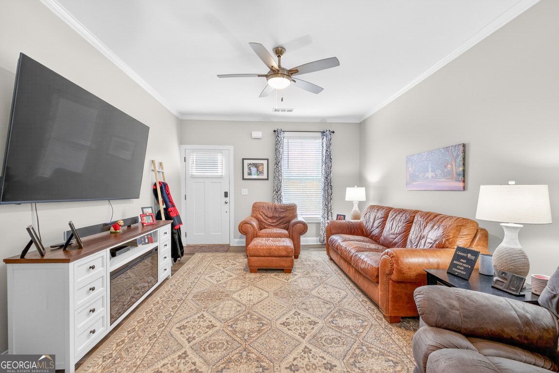 110 Magnolia Place Homer, GA 30547 - Photo 3 of 42 a living room with furniture and a flat screen tv