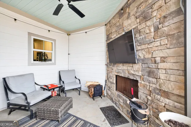 a living room with furniture and a fireplace