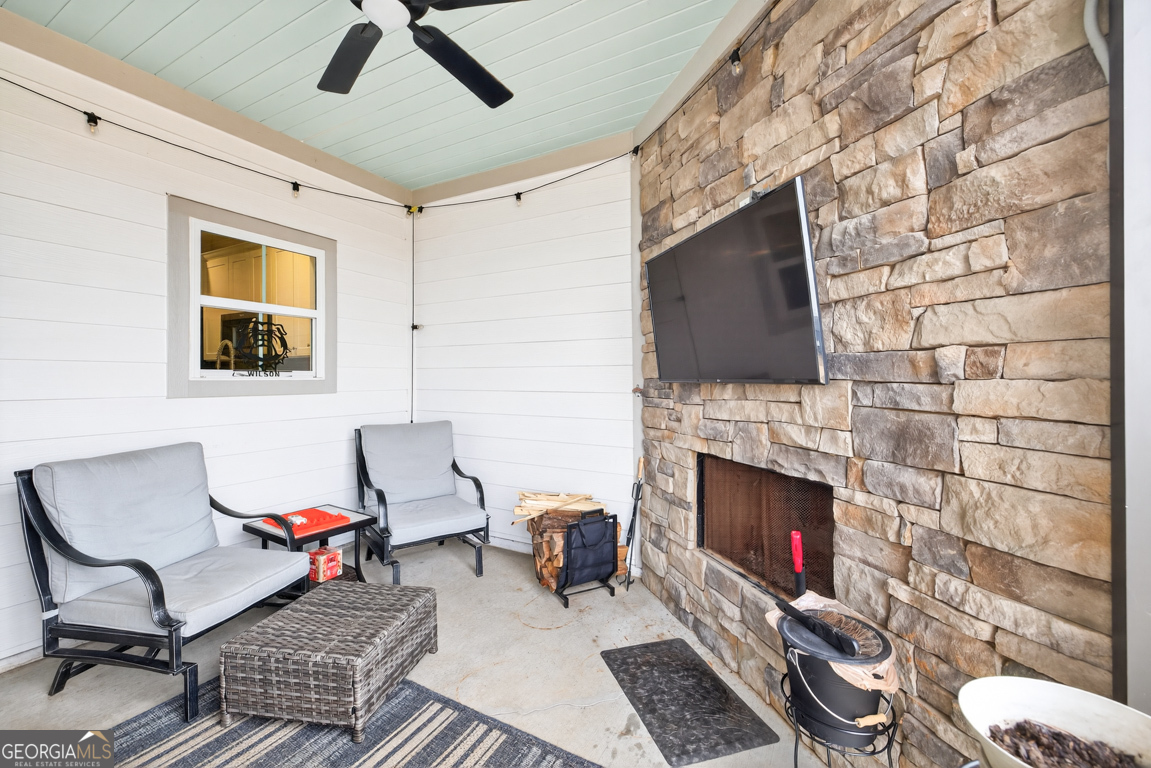 110 Magnolia Place Homer, GA 30547 - Photo 31 of 42 a living room with furniture and a fireplace