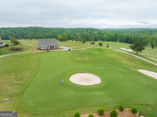 a view of a golf course with a lake