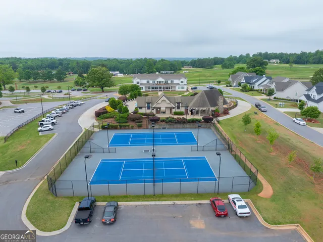 a view of a swimming pool with a patio and yard
