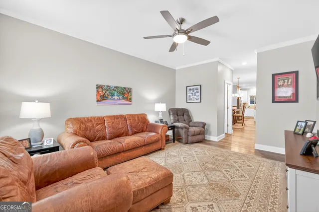 a living room with furniture and a lamp