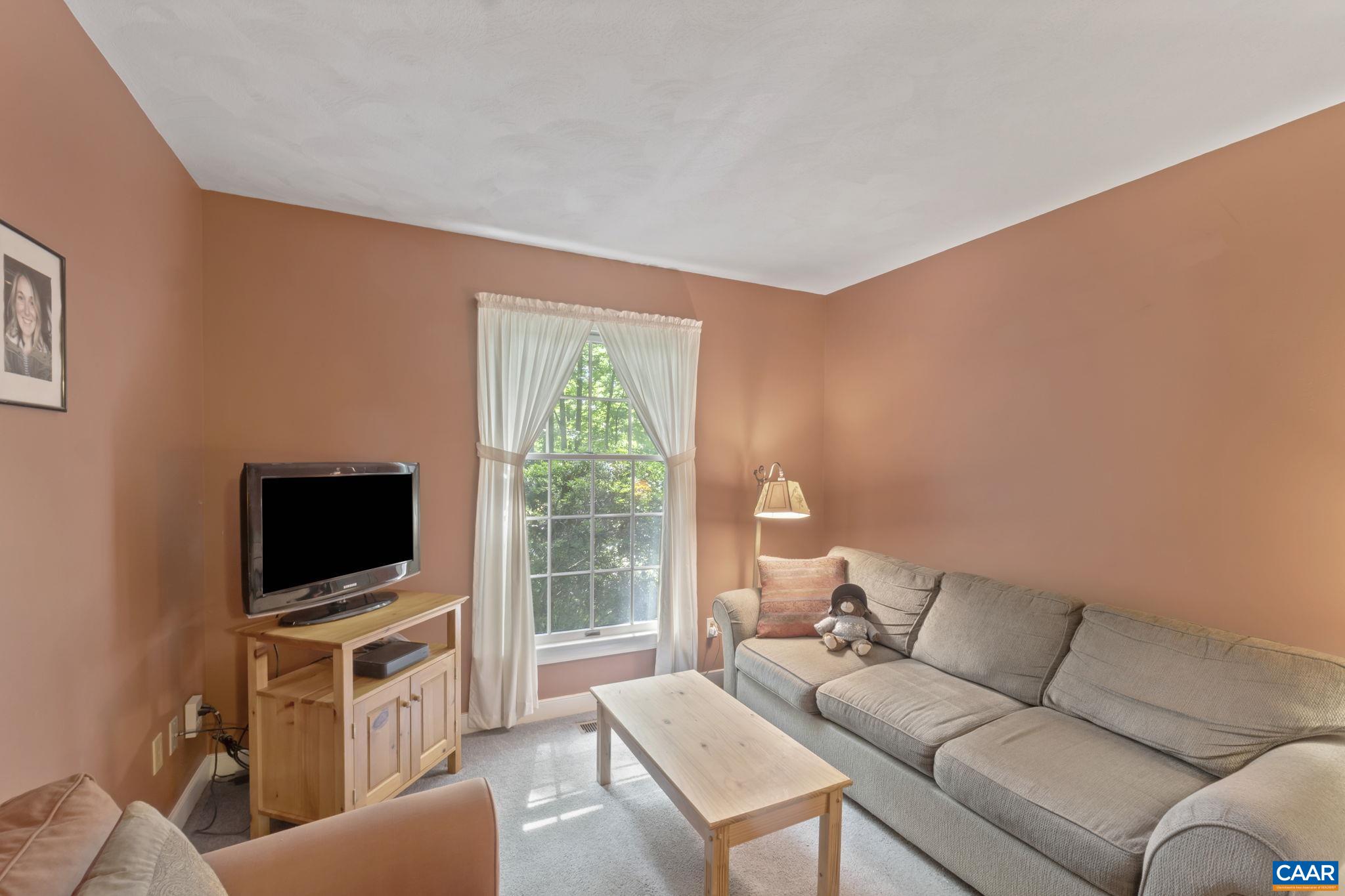 2 Whippoorwill Lane Palmyra, VA 22963 - Photo 22 of 36 a living room with furniture and a flat screen tv