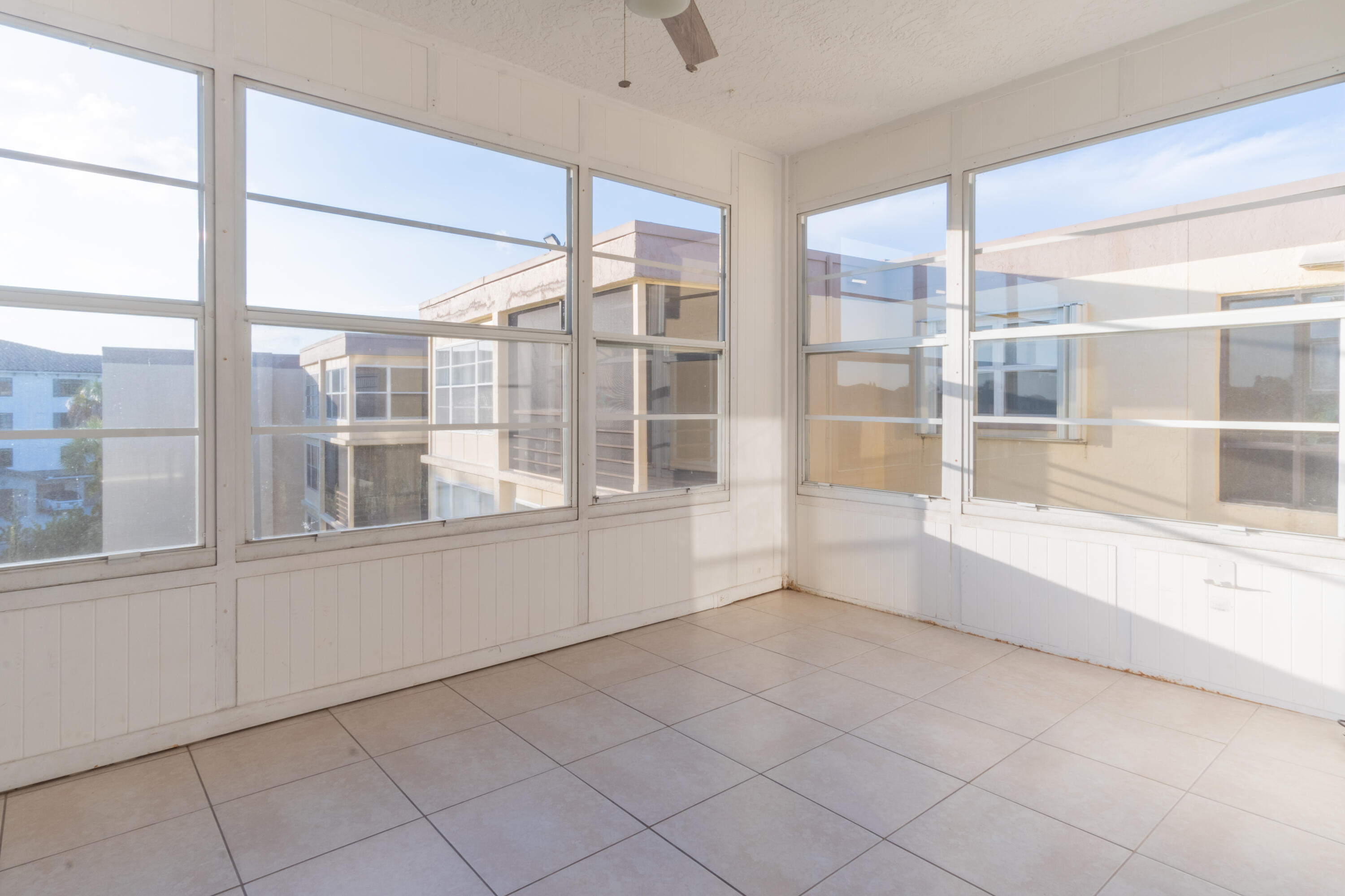 9355 Southwest 8th Street, Unit 406 Boca Raton, FL 33428 - Photo 15 of 22 a view of an empty room with a window