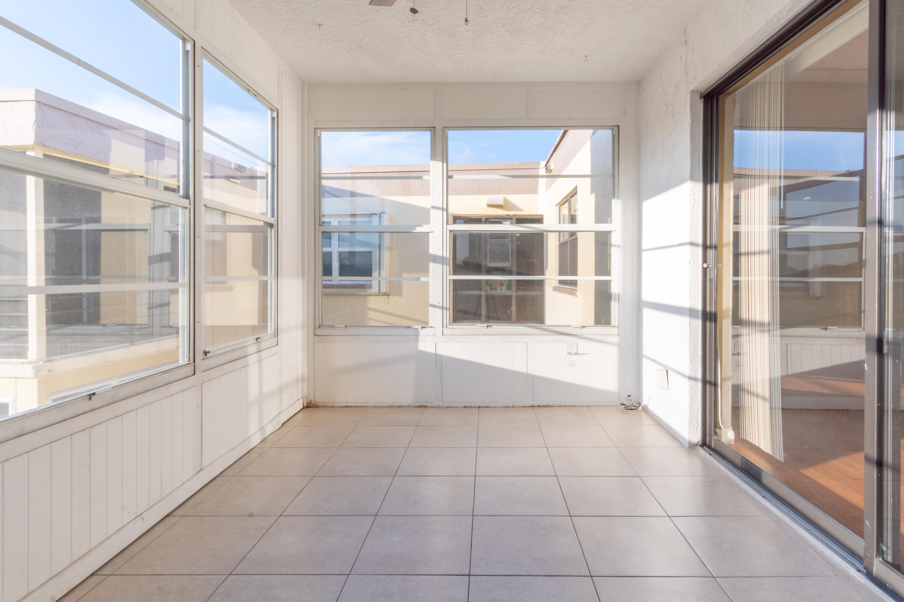 9355 Southwest 8th Street, Unit 406 Boca Raton, FL 33428 - Photo 16 of 22 a view of an empty room with a window