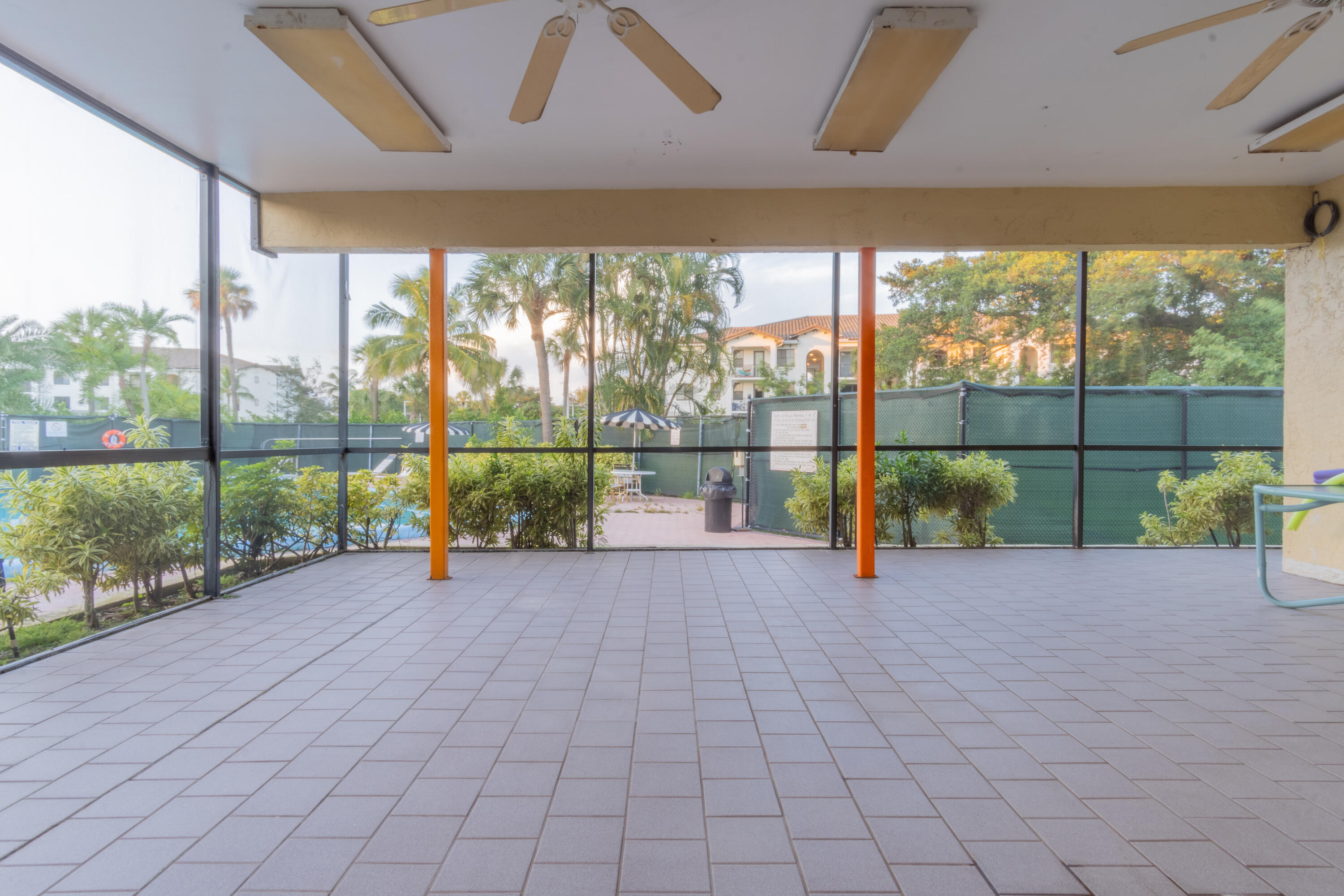 9355 Southwest 8th Street, Unit 406 Boca Raton, FL 33428 - Photo 22 of 22 a view of a garden with an outdoor seating space