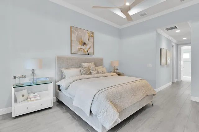 a bedroom with a bed and a night stand