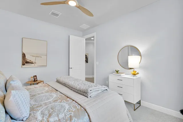 a bedroom with bed and window