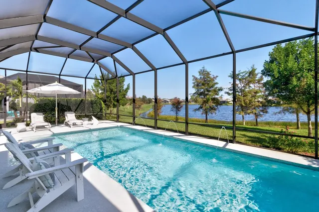 a view of a swimming pool with a patio