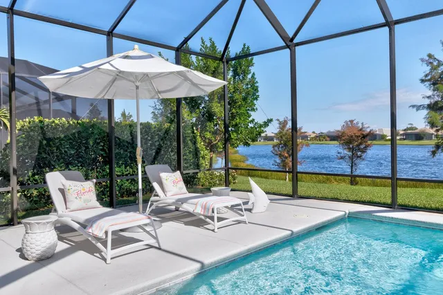 a view of a chair and table in the garden