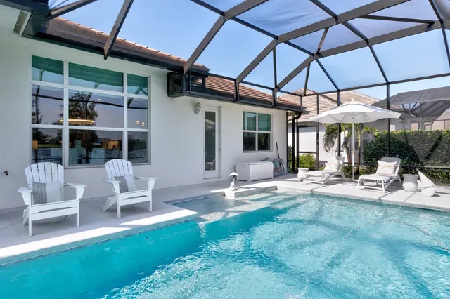 a view of a chair and tables in the patio