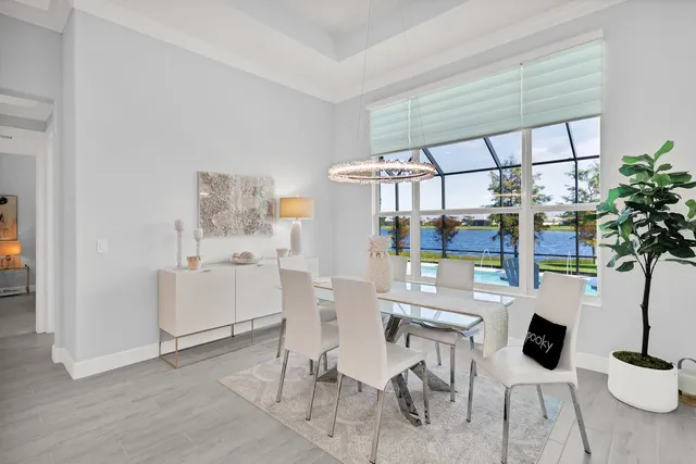 a room with furniture a rug and white walls