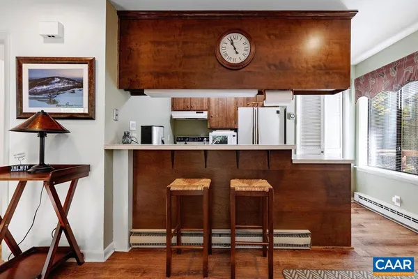 a view of a chair and table in a kitchen