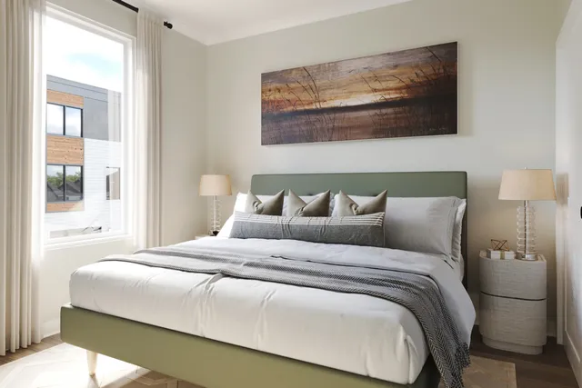 a bedroom with a bed and glass window