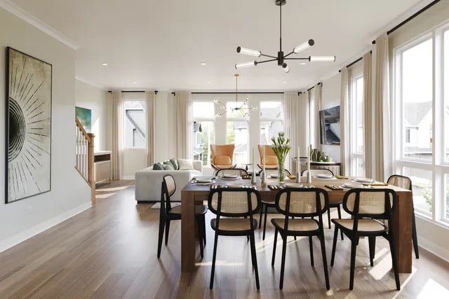a view of a a dining room with furniture window and wooden floor