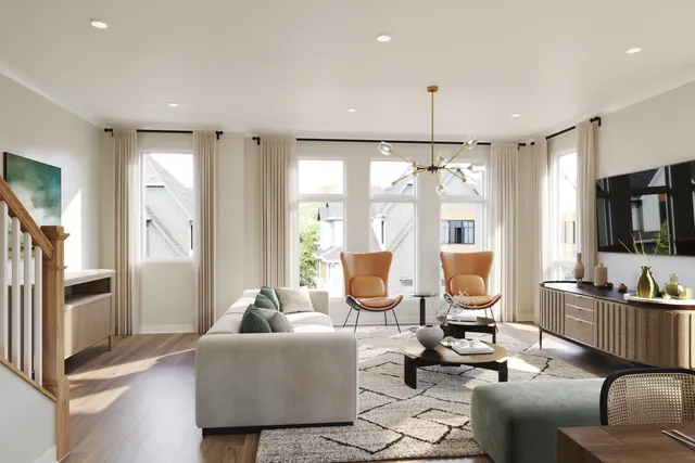 a living room with furniture and large windows