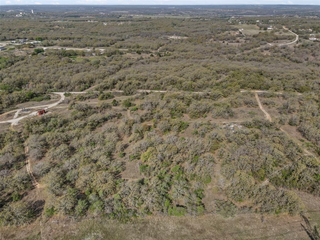 5 County Road 3855 Poolville, TX 76487 - Photo 11 of 16 an aerial view of residential houses with outdoor space