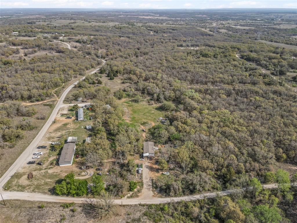 5 County Road 3855 Poolville, TX 76487 - Photo 15 of 16 an aerial view of houses with yard